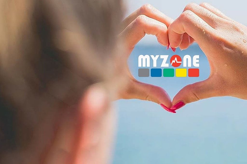 MYZONE logo with woman's hands around it in a heart shape